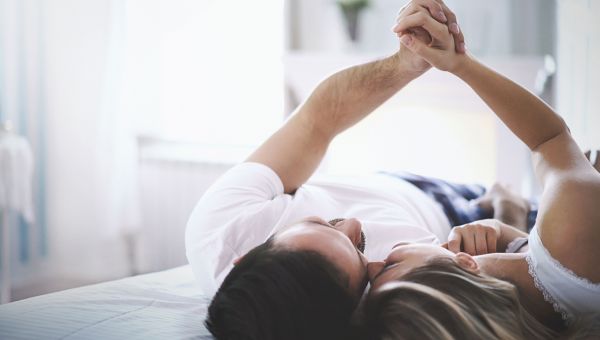 Couple laying in bed together