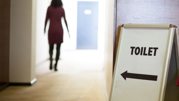 woman using public bathroom