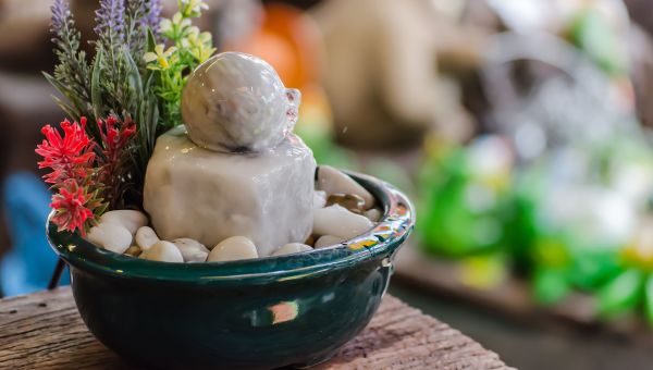 Moving water statue set up in a living room.