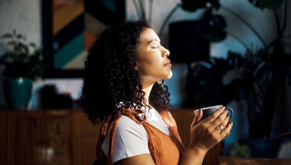 woman meditating with coffee