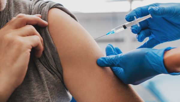 being vaccinated in left arm