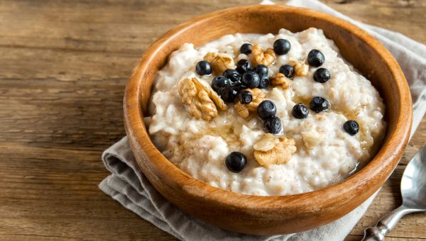 oatmeal and fruit in a wooden bowl