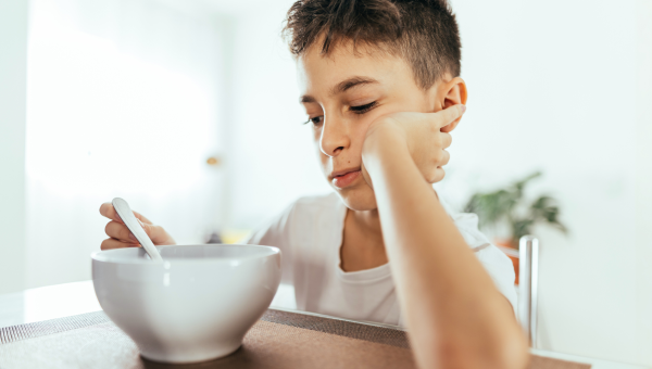 boy with autism not wanting to eat food, picky eater