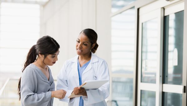 woman talking to obgyn