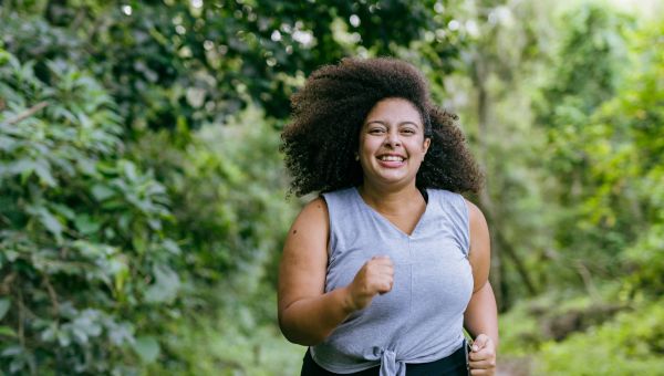 young woman running in park