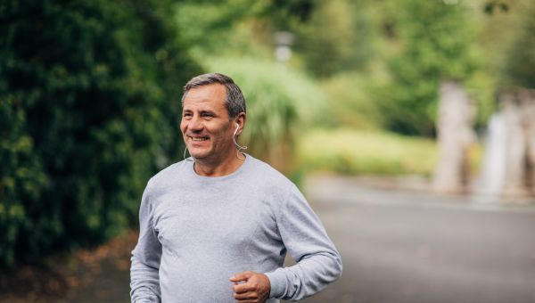 mature man jogging in park