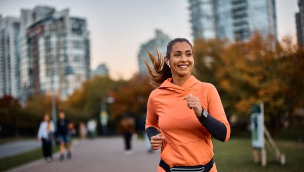 millennial woman running in park