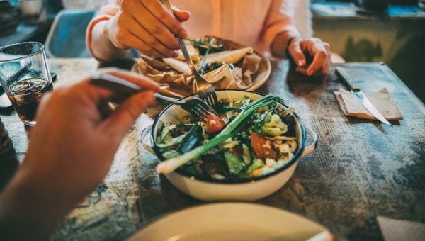 couple sharing plate of food