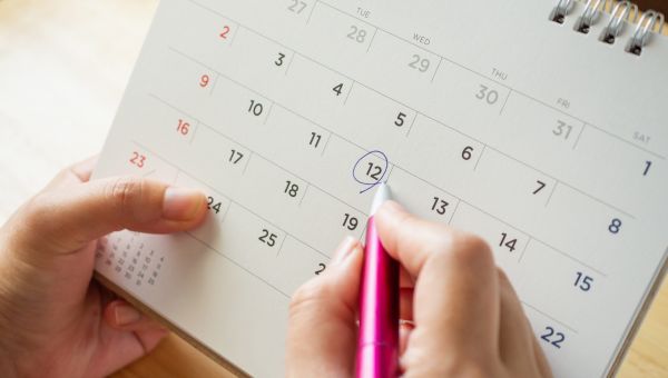 close up of someone with a period calendar