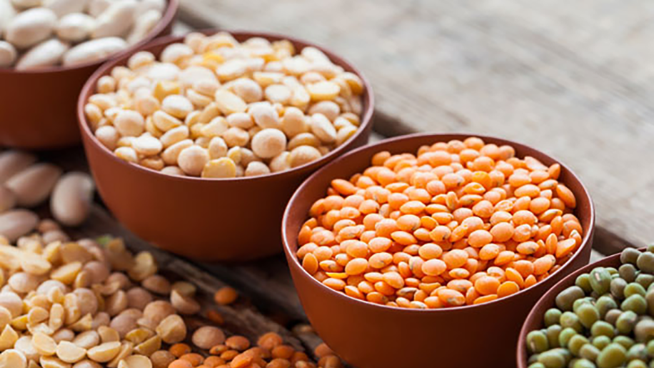 Bowls of various dry beans.