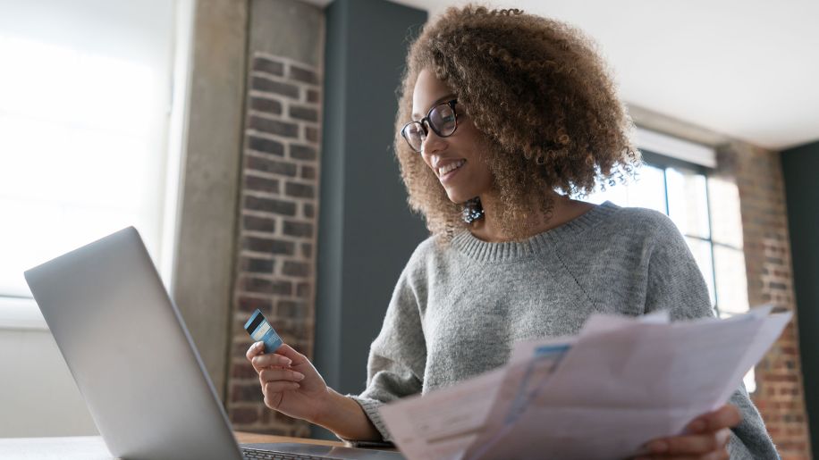 Woman checks her bank statement online.