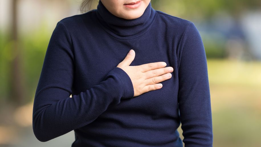 Woman experiencing pain in her breast