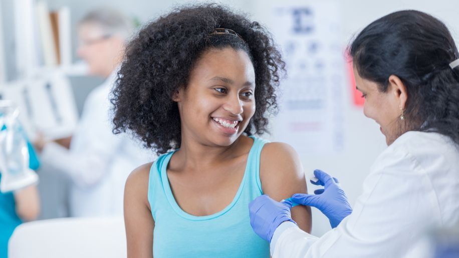 pre-teen getting a meningococcal conjugate vaccine