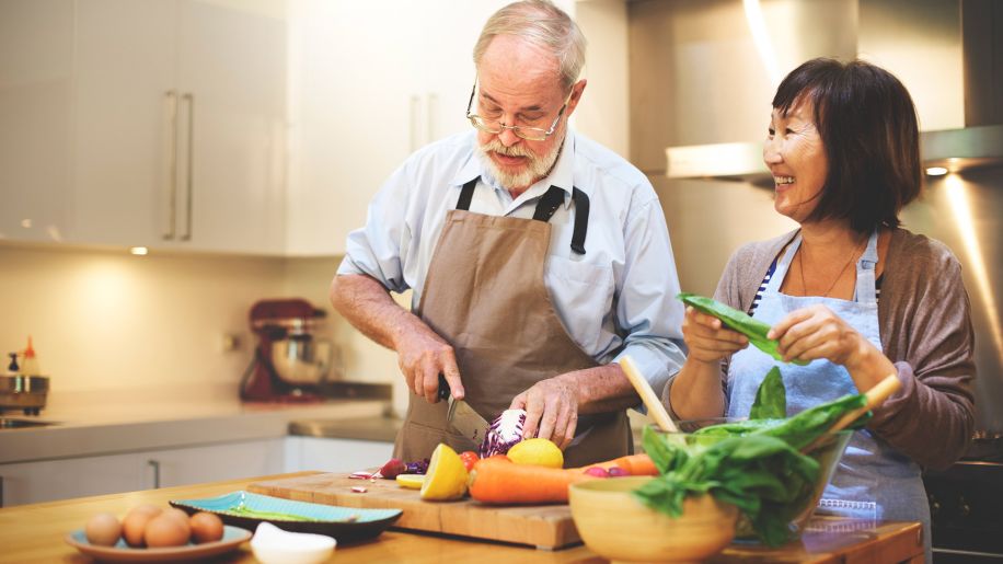 senior couple cooking kitchen