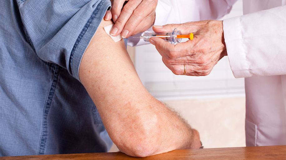 Senior man getting an injection