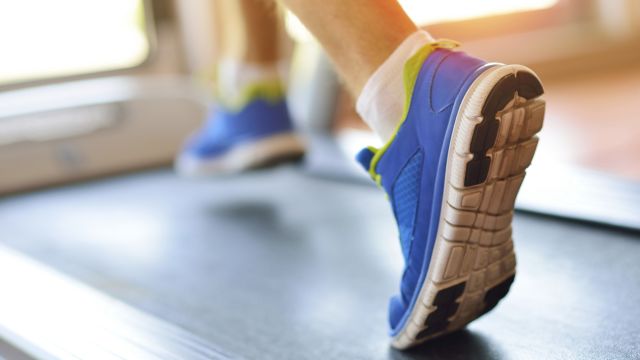 pair of blue shoes walking on treadmill