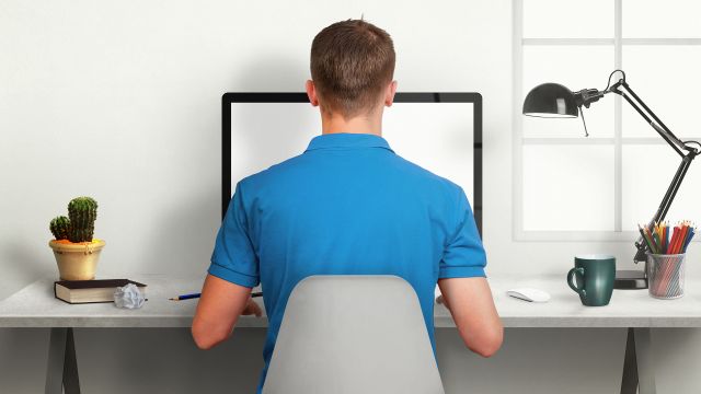 man sitting at desk