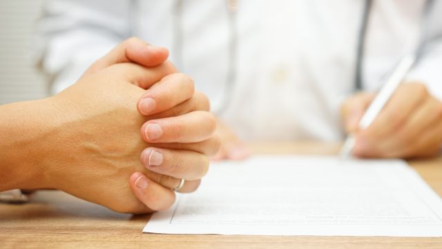 close up of patient's hand and doctor