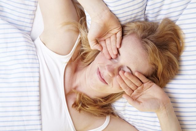 woman waking up sleepy