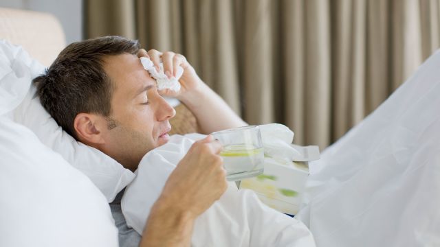 man sick in bed