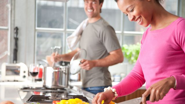 happy couple cooking