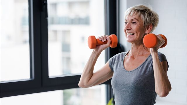 older woman lifting weights