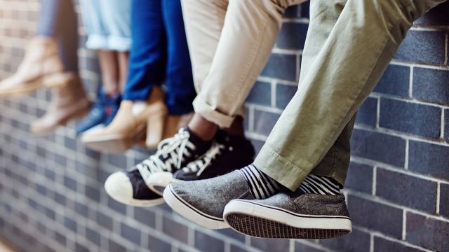 A group of college students sit together. Teens and college-age young adults make up a significant percentage of meningitis B patients.