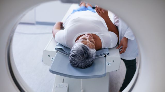 Woman laying down, about to get an MRI.