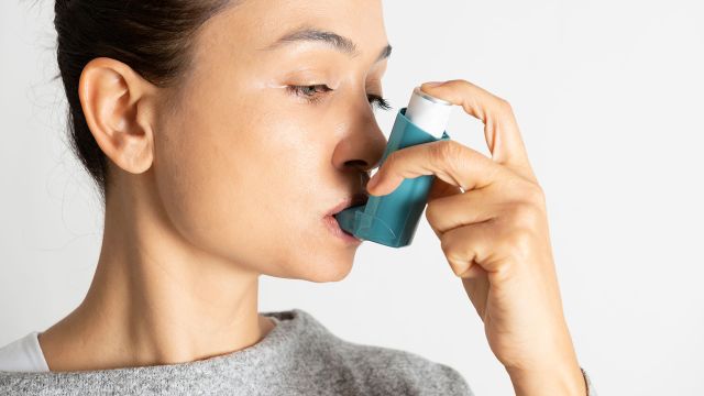 woman using inhaler