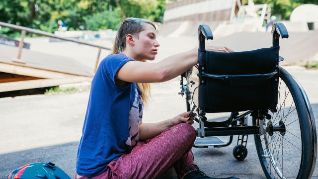 Teen girl with stunt wheelchair