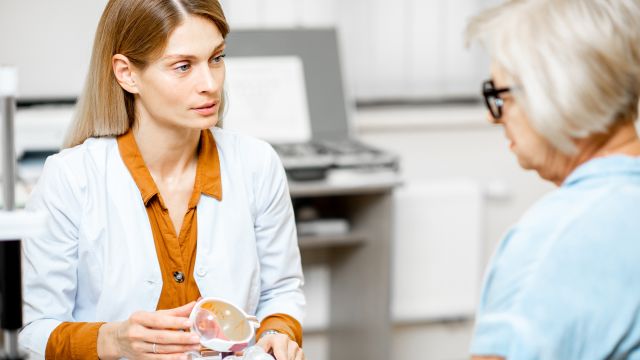 Senior woman meets with her eye doctor.