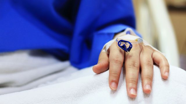 A breast cancer patient receives an infusion of anti-cancer drugs. Several targeted therapies are given by infusion.