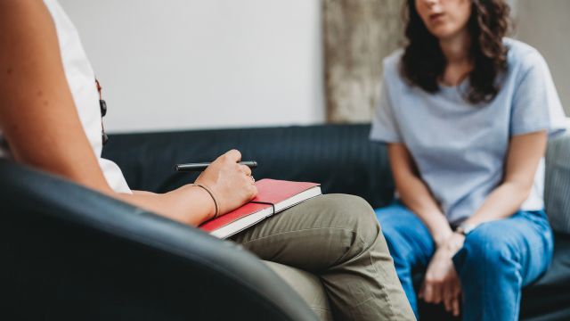 woman speaking with a therapist