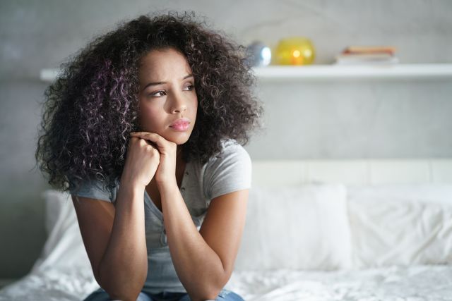 woman looking pensive