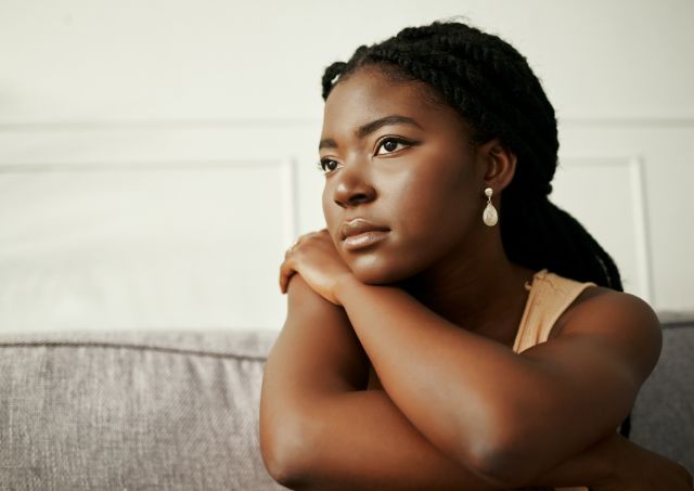 A woman sitting alone and contemplative