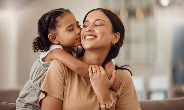 Child hugging a parent