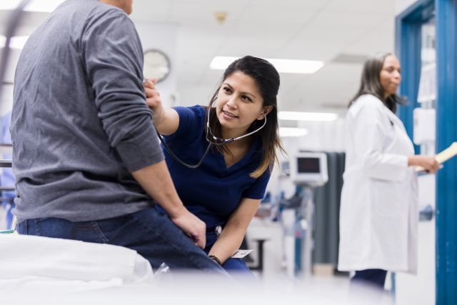 emergency room staff tending to patient