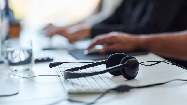 Headphones sitting on a keyboard