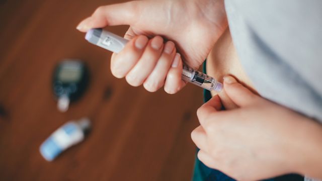 A woman injects a diabetes medication under the skin on her stomach. Several diabetes medications provide protection against cardiovascular disease.