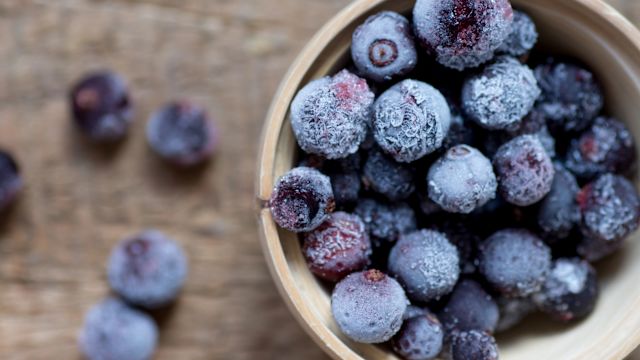 A closeup of a bowl of frozen berries. Colorful berries contain antioxidants and nutrients that can help reduce inflammation, and frozen fruit is often less expensive than fresh fruit.