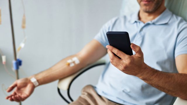 A young man receives an infusion of immunoglobulin therapy as part of his treatment for primary immunodeficiency.