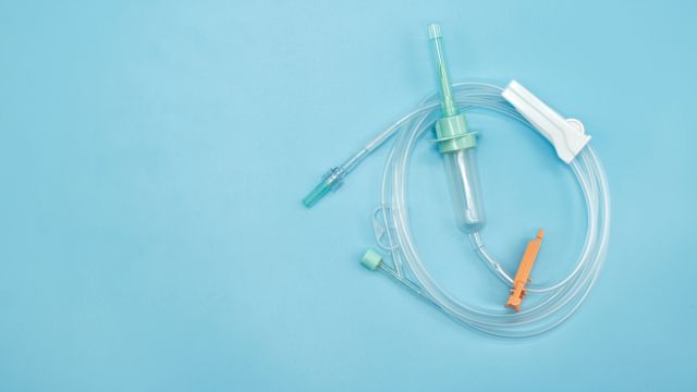 Infusion needles against a blue background. Immunoglobulin infusions for primary immunodeficiency can be delivered with intravenous or subcutaneous infusions. 