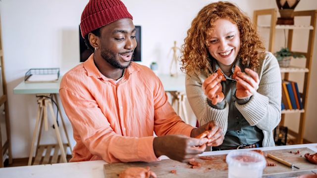 Two young people make clay sculptures. Fun, creative activities are a simple way to help reduce stress when living with a chronic condition like PNH.