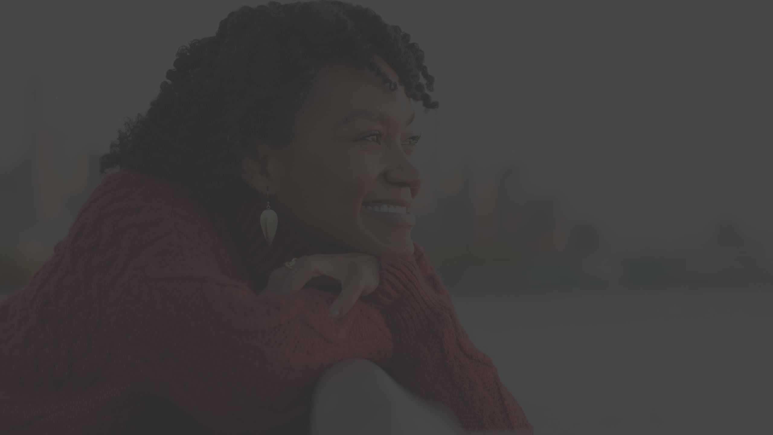 woman standing outside smiling