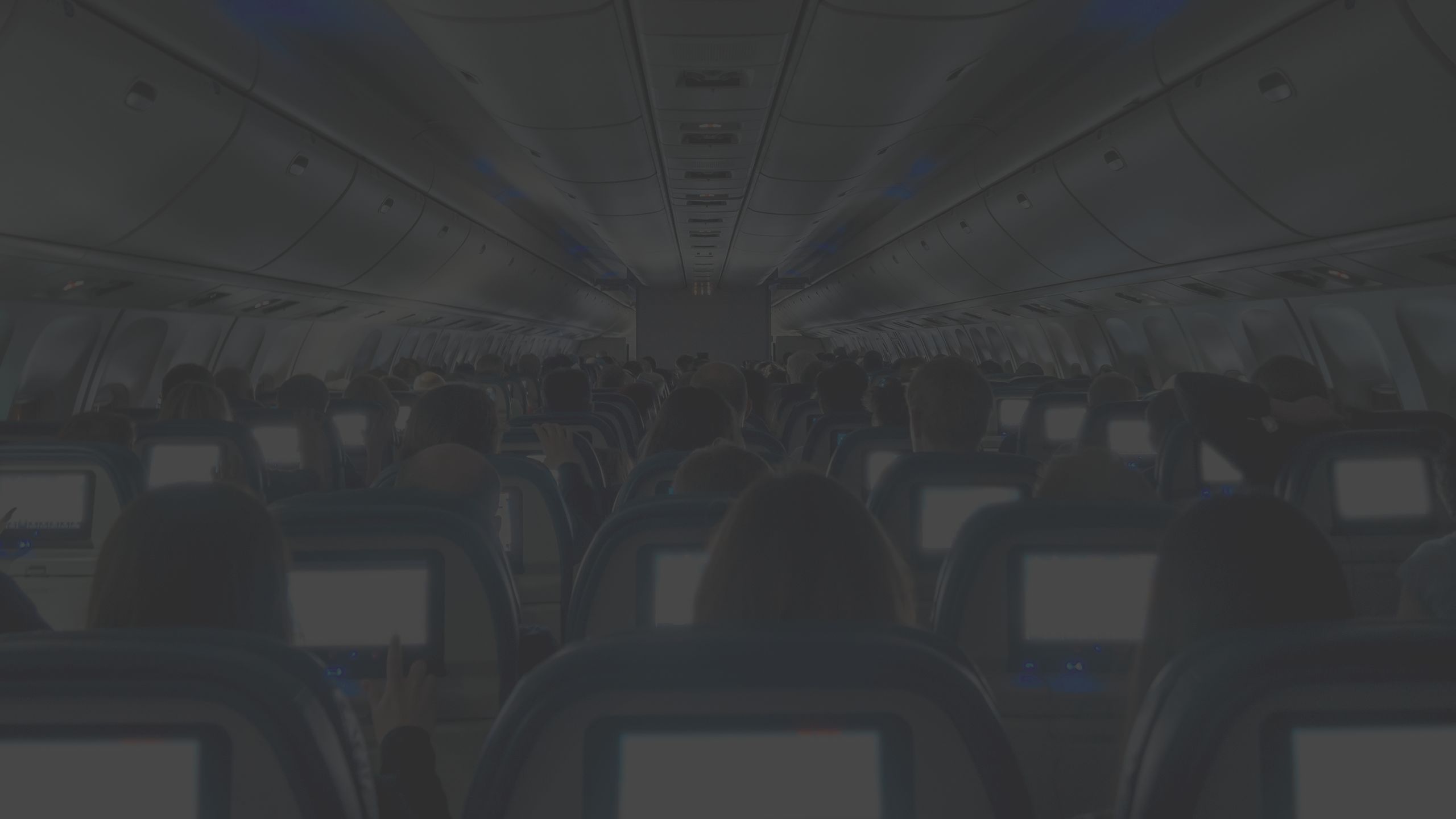 view of passengers seated in an airplane