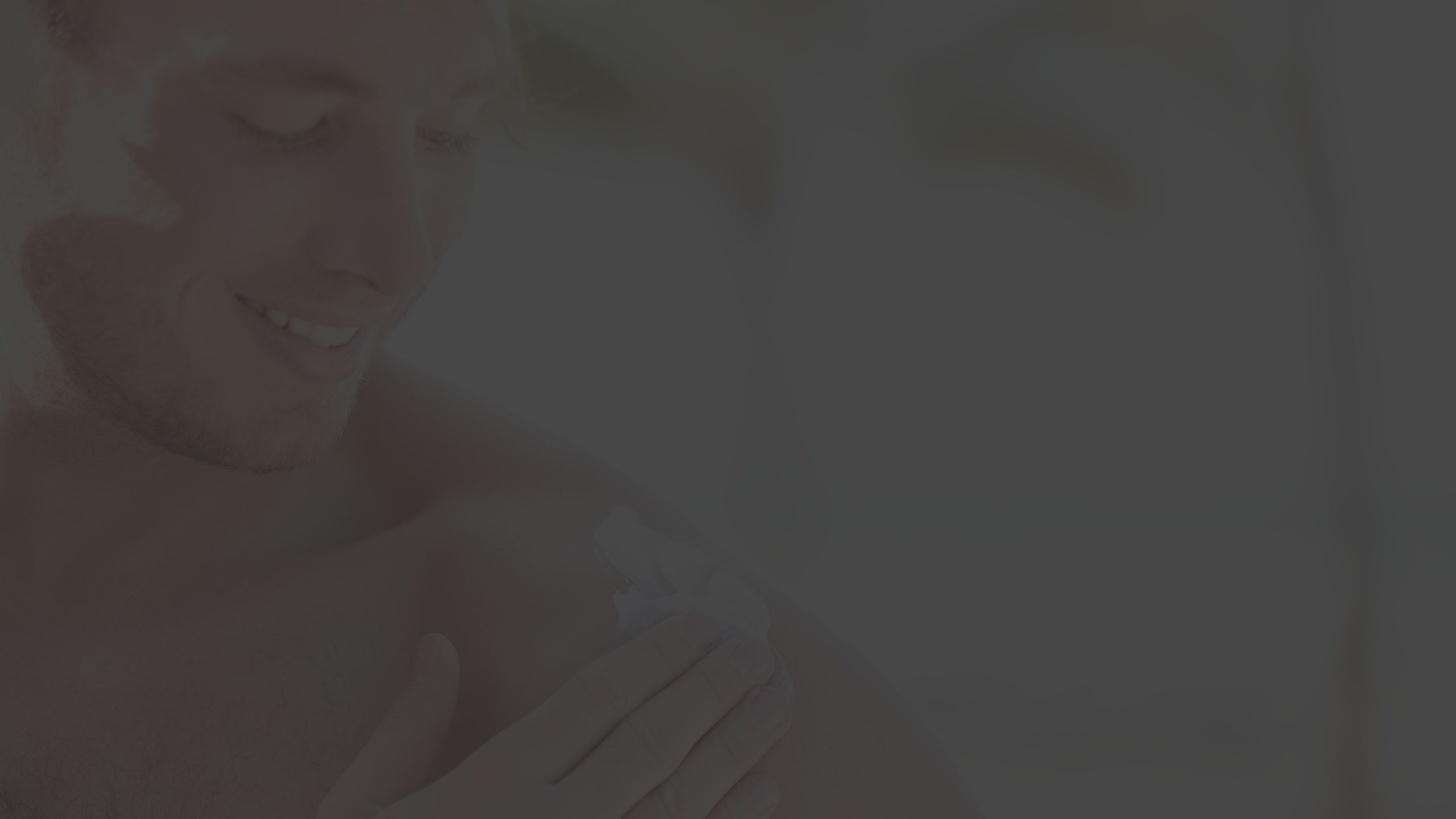 man applying sunscreen