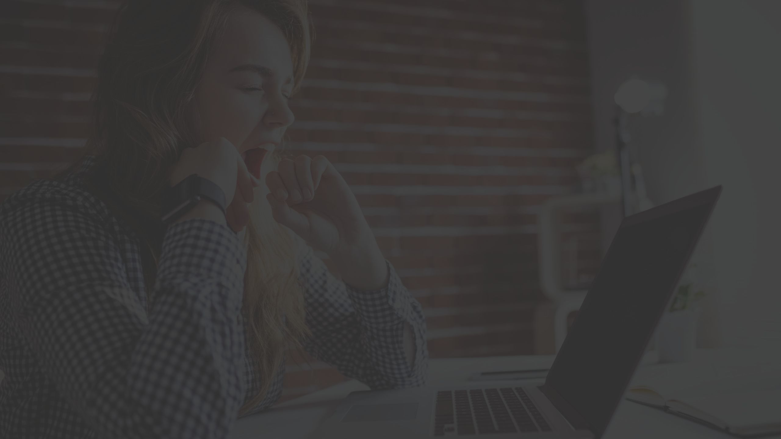 Young woman yawning