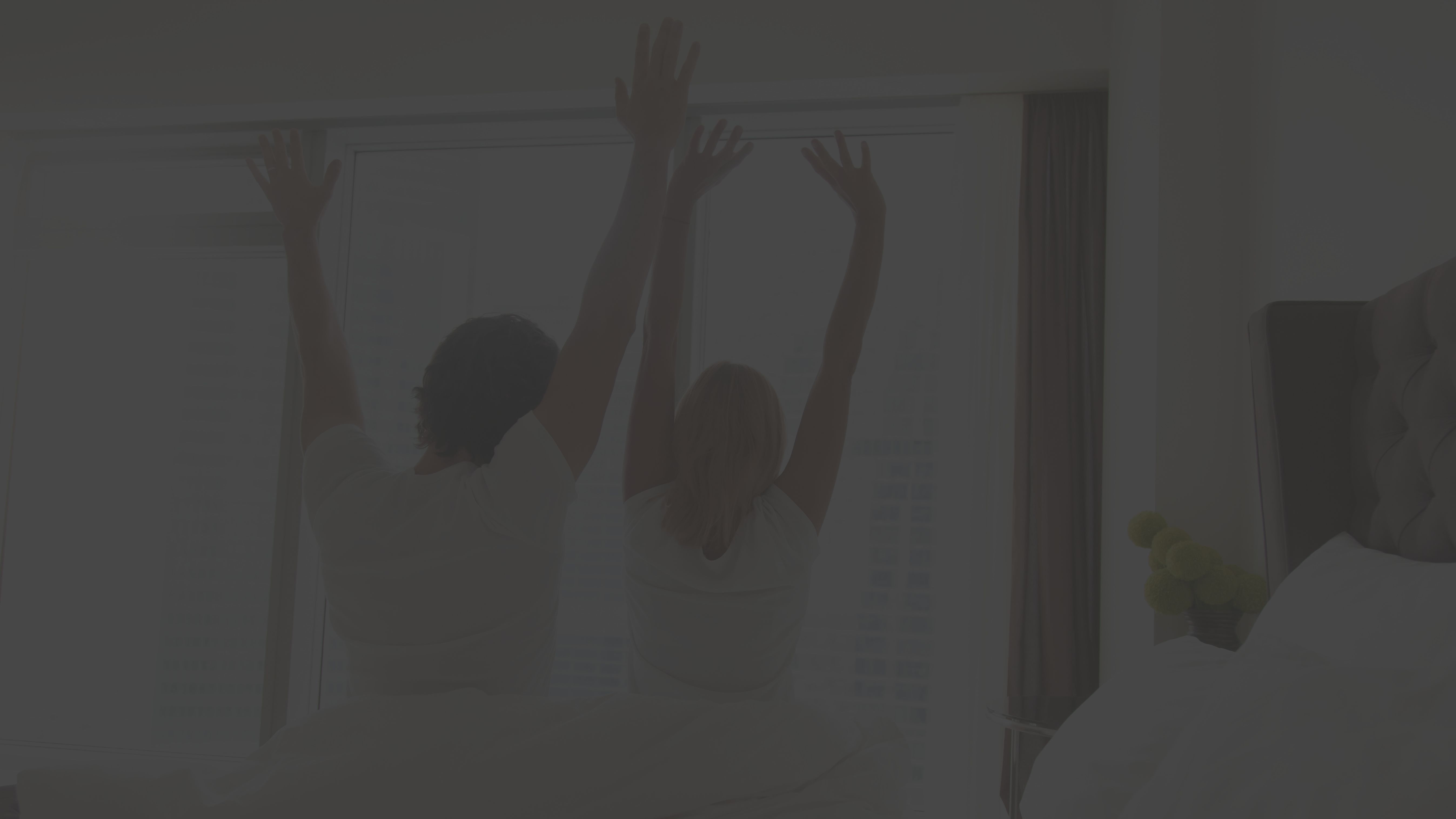 two people waking up together
