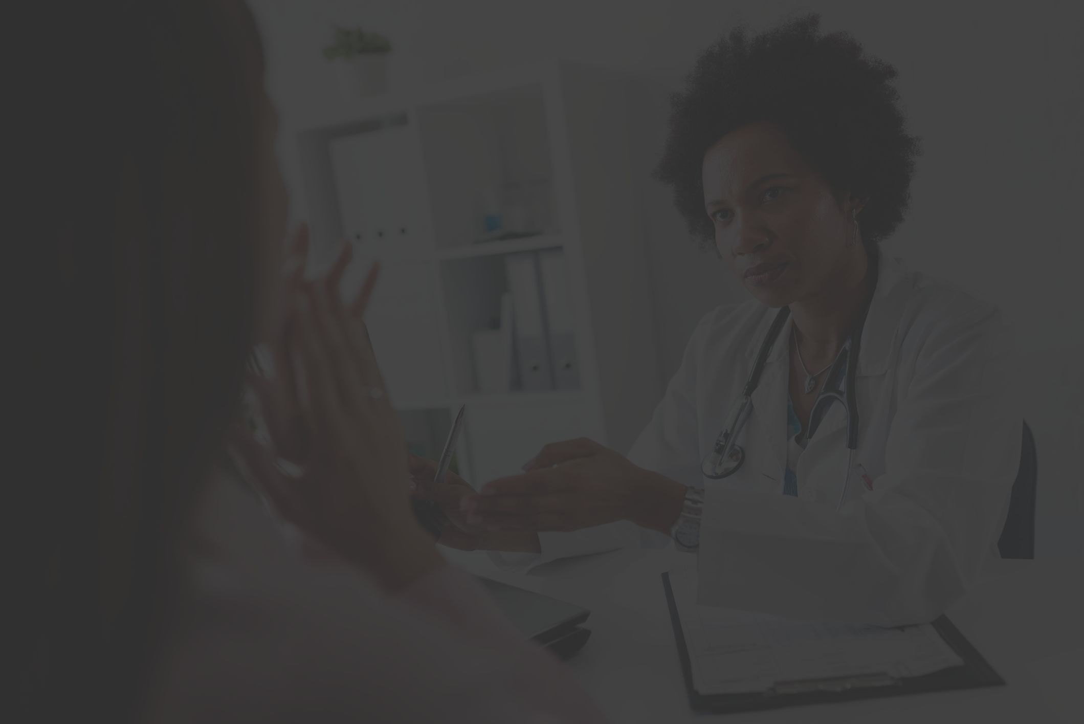 Healthcare provider talking to a patient