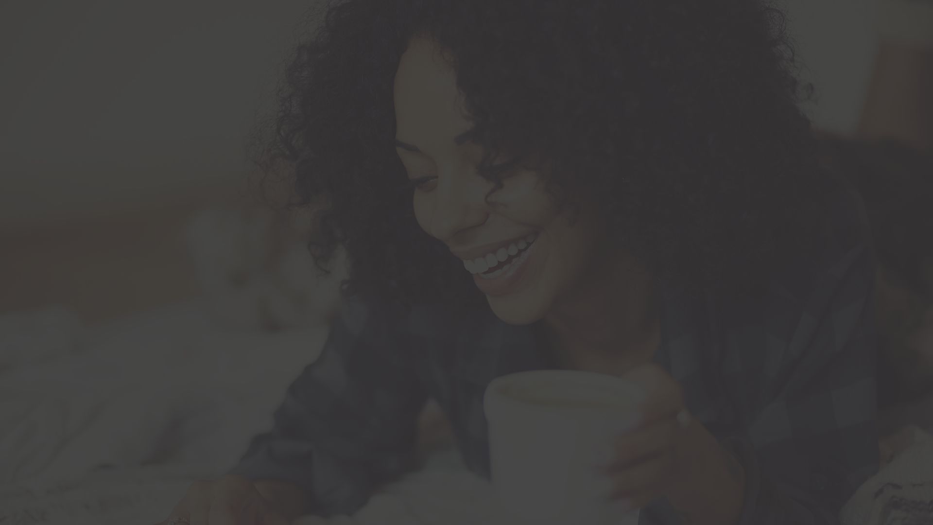 Happy woman drinking coffee